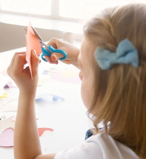 Child using scissors